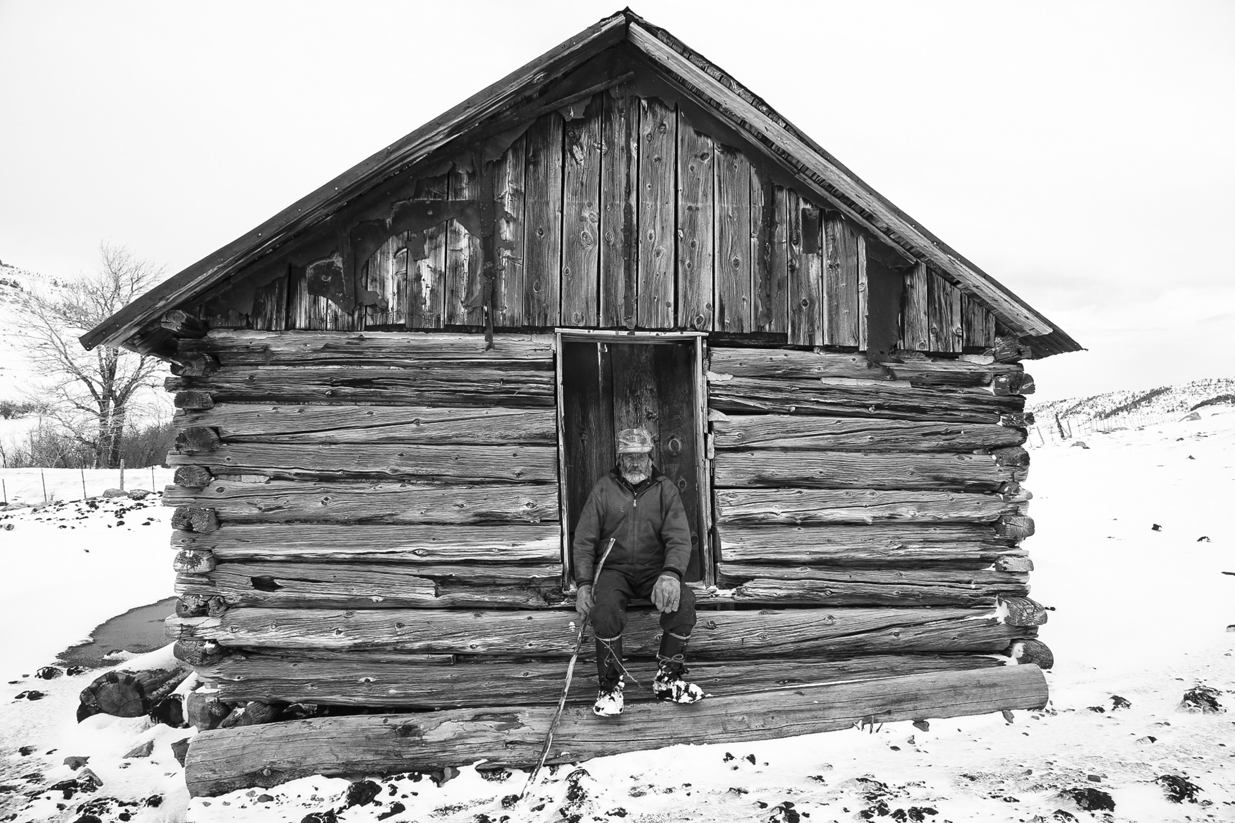 Rancher sitting on his childhood home.